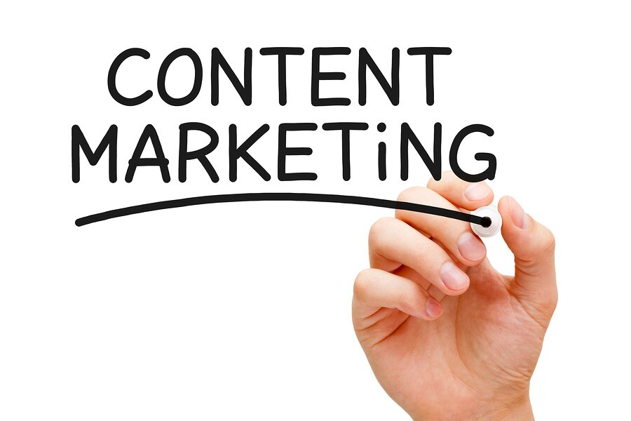 handing writing on whiteboard saying content marketing strategy